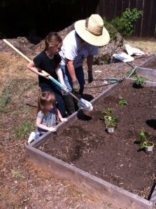 Lily and Olivia helping to plant the garden this spring.